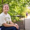 female student sitting and smiling