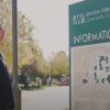 man reading sign