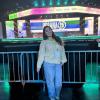 Angelica smiling in front of stage at Urbana 25