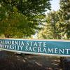 The Sacramento State campus sign is large and curved on campus.