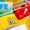 Life board game on the Make New Friends for Life square with the words "The Life Ahead" in the background.