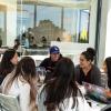 Group of students gathered outside laughing and discussing