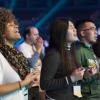 Diverse group of young men and women worshiping together