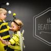 two small children dressed as bumblebees, and a graphic reading "The Beatitudes"