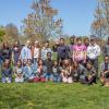 Group photo of students standing outside on lawn