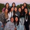 a group of Asian American students smiling at the camera