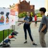 two students on campus looking at a proxe 