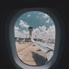 the wing of an airplane seen from inside the plane