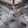 A busy four-way intersection in an urban downtown