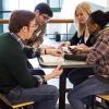 Group of diverse students gathered for Bible study in college student center