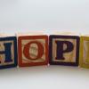 Multicolored building blocks spelling out the word "hope"