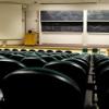 Empty classroom auditorium with stage and chalkboards