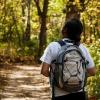Person hiking along wooded path