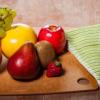 Fruit resting on a wooden table representing the fruit of the Spirit.