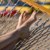 Closeup of person's feet propped up on hammock