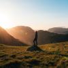 Person standing on rock in field