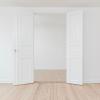 Empty rooms with plain white walls and open door