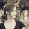 Black and white portrait of young woman looking off to the side