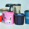 a collection of random mugs