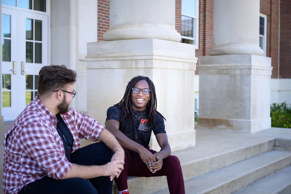 laughing with fellow alumni